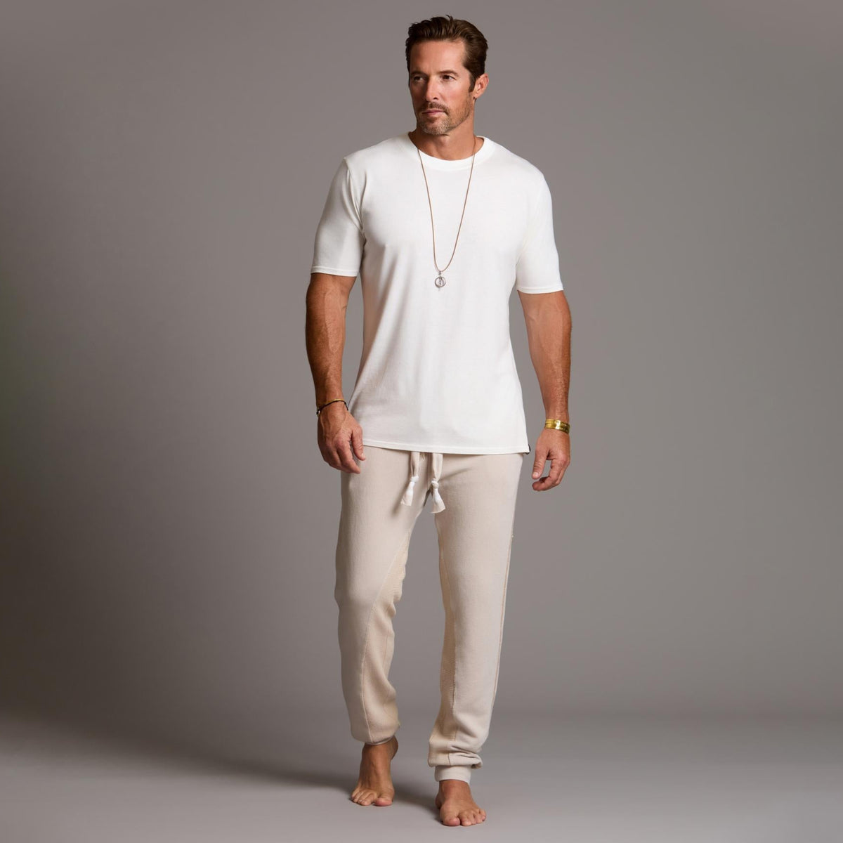 man modeling pants in white stone