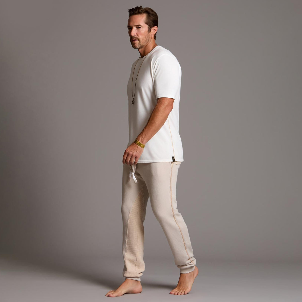man modeling pants in white stone