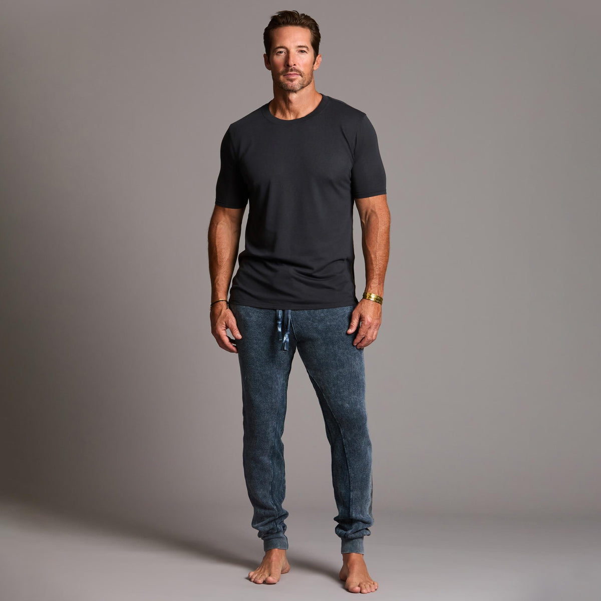 man modeling pants in mineral blue
