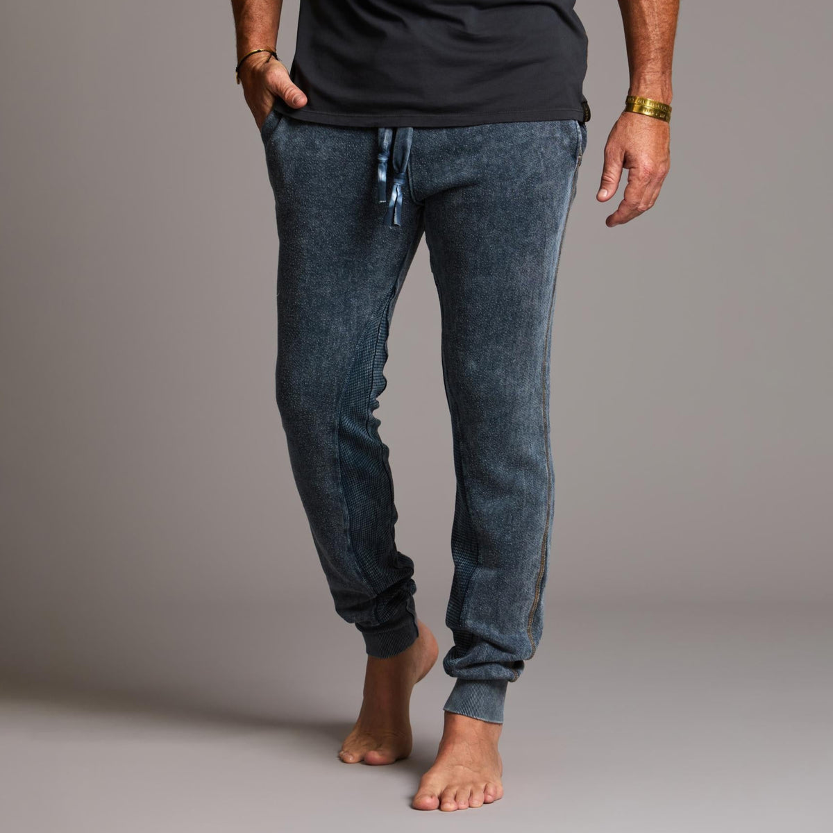 man modeling pants in mineral blue