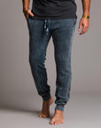 man modeling pants in mineral blue