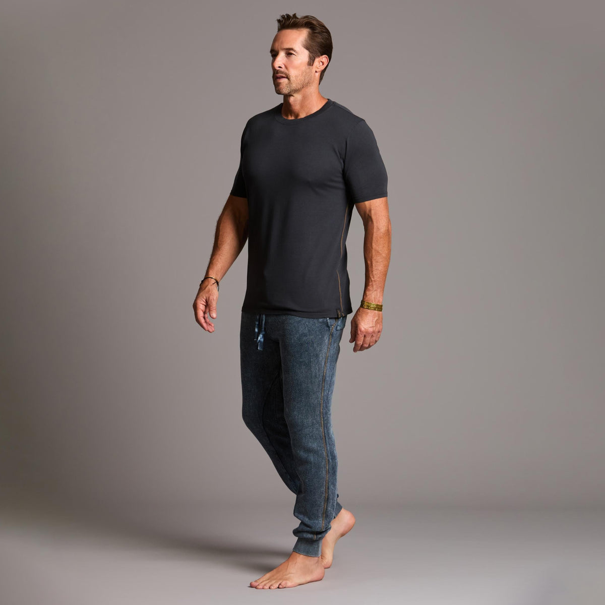 man modeling pants in mineral blue