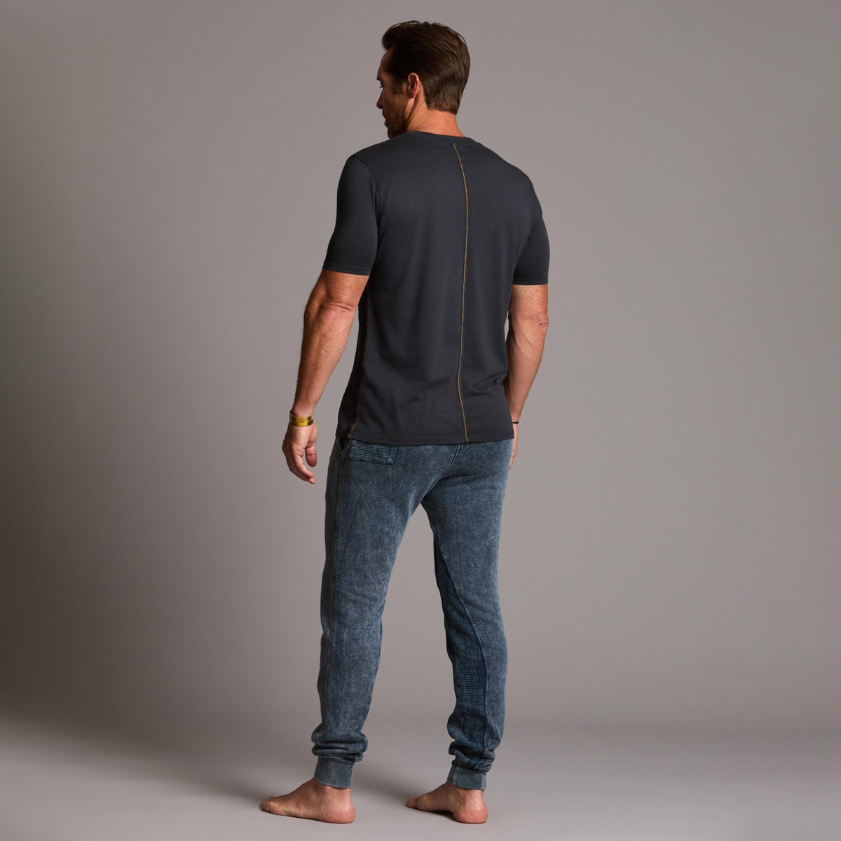 man modeling pants in mineral blue