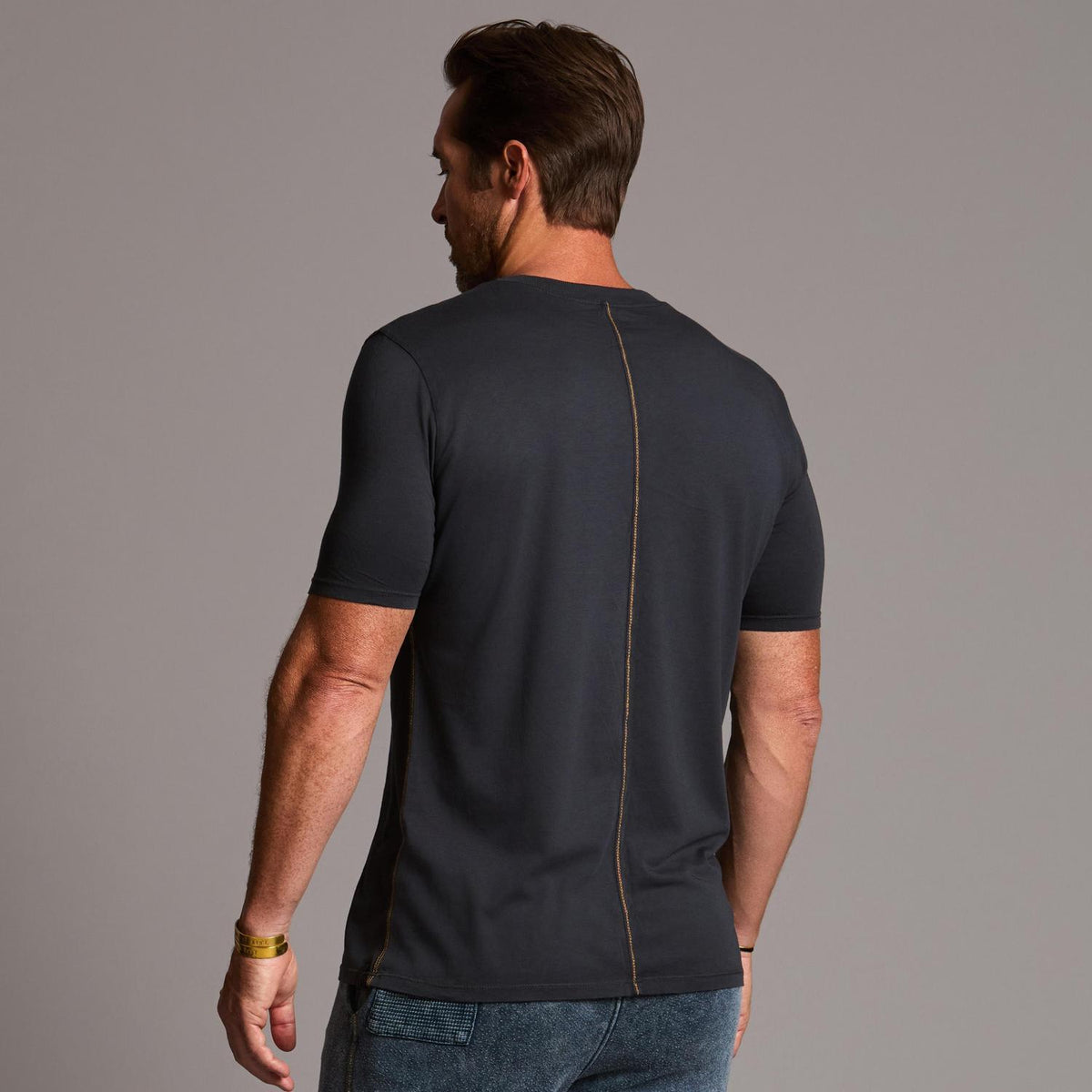 man modeling a tee in charcoal blue