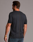man modeling a tee in charcoal blue