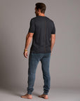 man modeling pants in mineral blue