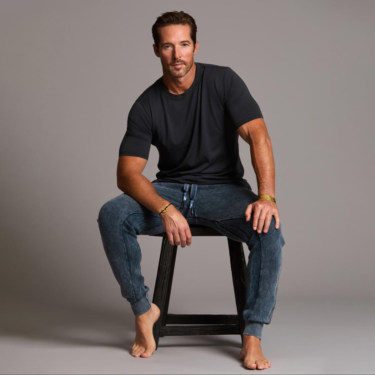 man modeling pants in mineral blue