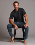 man modeling pants in mineral blue
