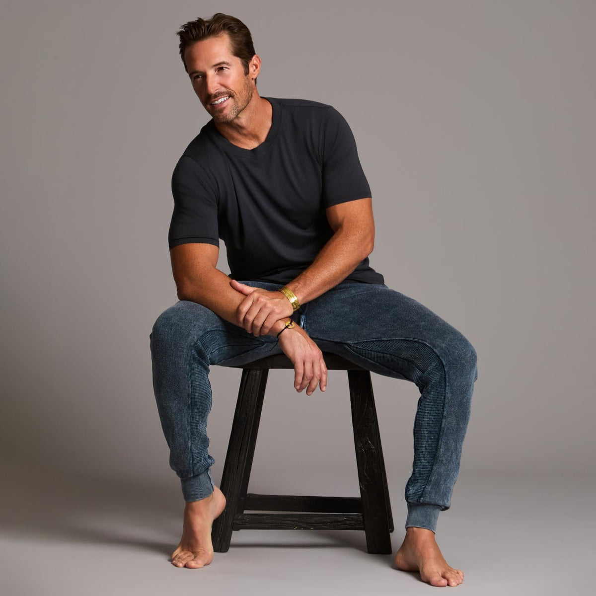 man modeling pants in mineral blue