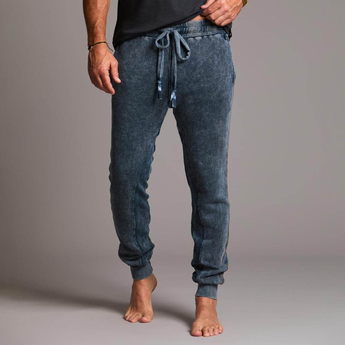 man modeling pants in mineral blue