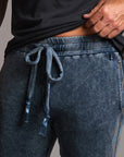 man modeling pants in mineral blue
