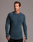 A man modeling a One Golden Thread Waffle Long Sleeve Raglan shirt in blue mineral
