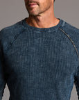 A man modeling a One Golden Thread Waffle Long Sleeve Raglan shirt in blue mineral