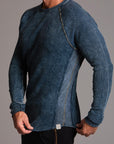 A man modeling a One Golden Thread Waffle Long Sleeve Raglan shirt in blue mineral