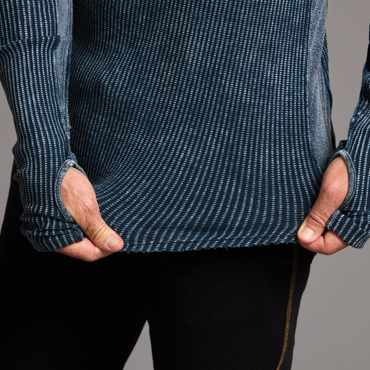 A man modeling a One Golden Thread Waffle Long Sleeve Raglan shirt in blue mineral