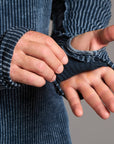 A man modeling a One Golden Thread Waffle Long Sleeve Raglan shirt in blue mineral