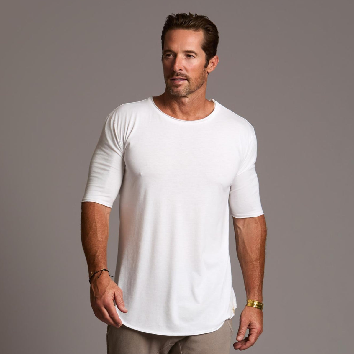 Male modeling white crew neck shirt