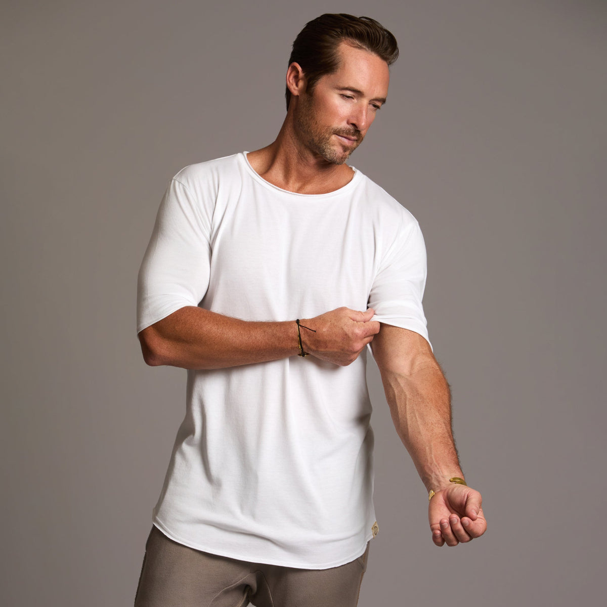 Male modeling white crew neck shirt