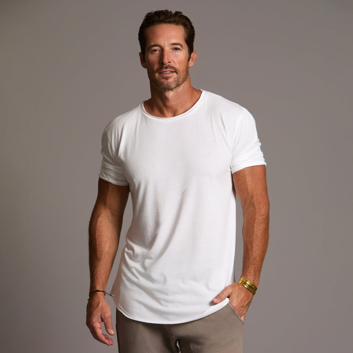 Male modeling white crew neck shirt