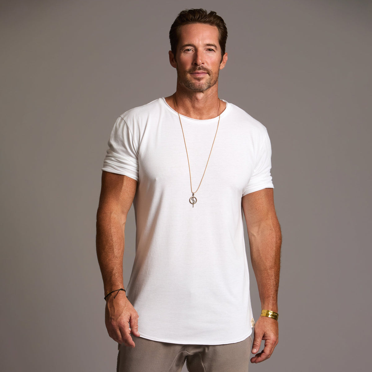 Male modeling white crew neck shirt