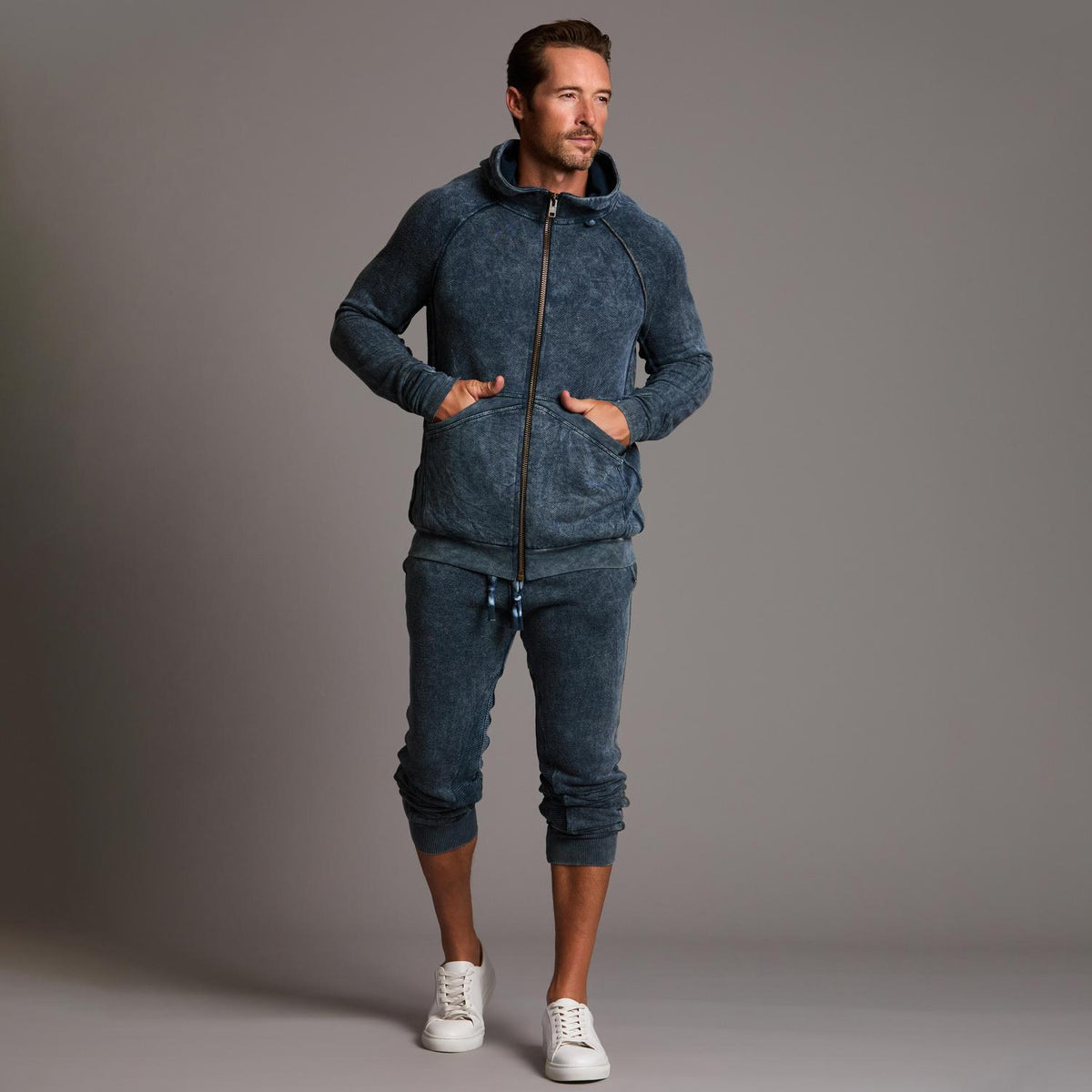 man modeling pants in mineral blue