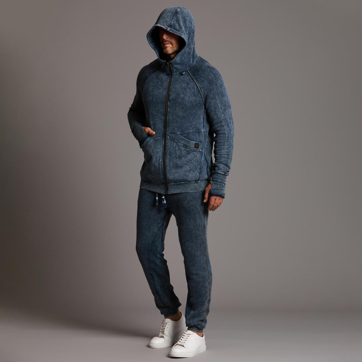 man modeling pants in mineral blue