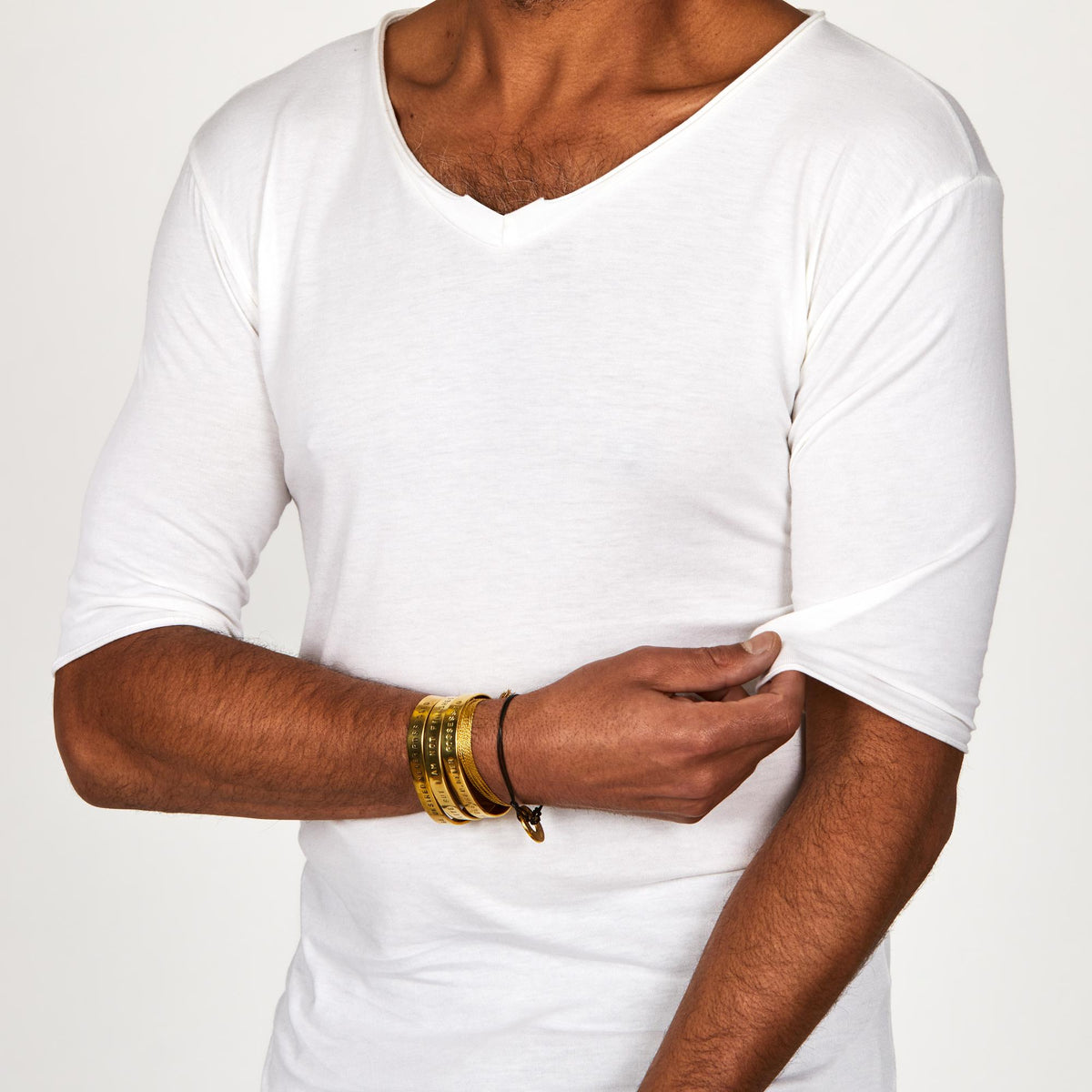 Male modeling white v neck shirt 