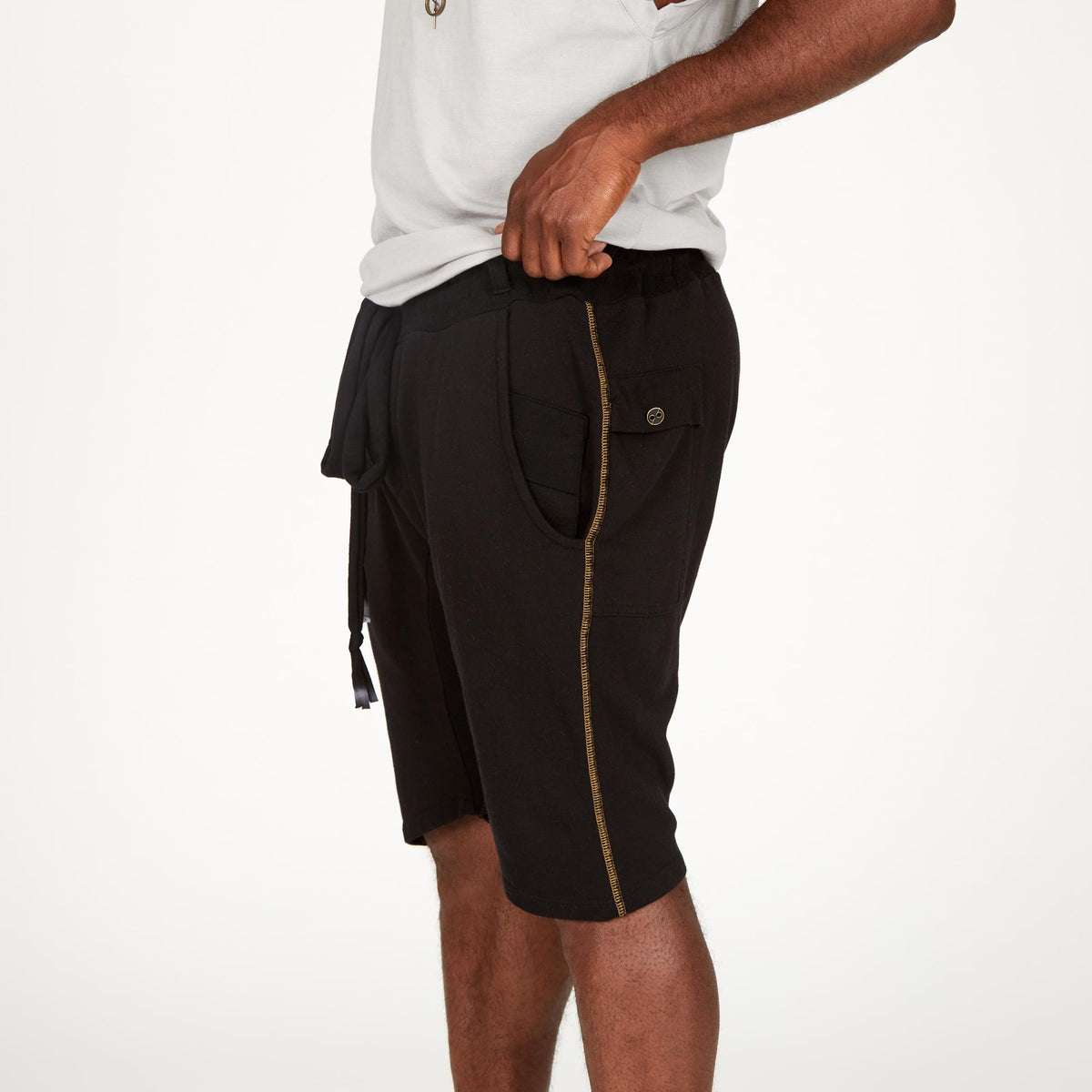 A man modeling black milanos mid shorts