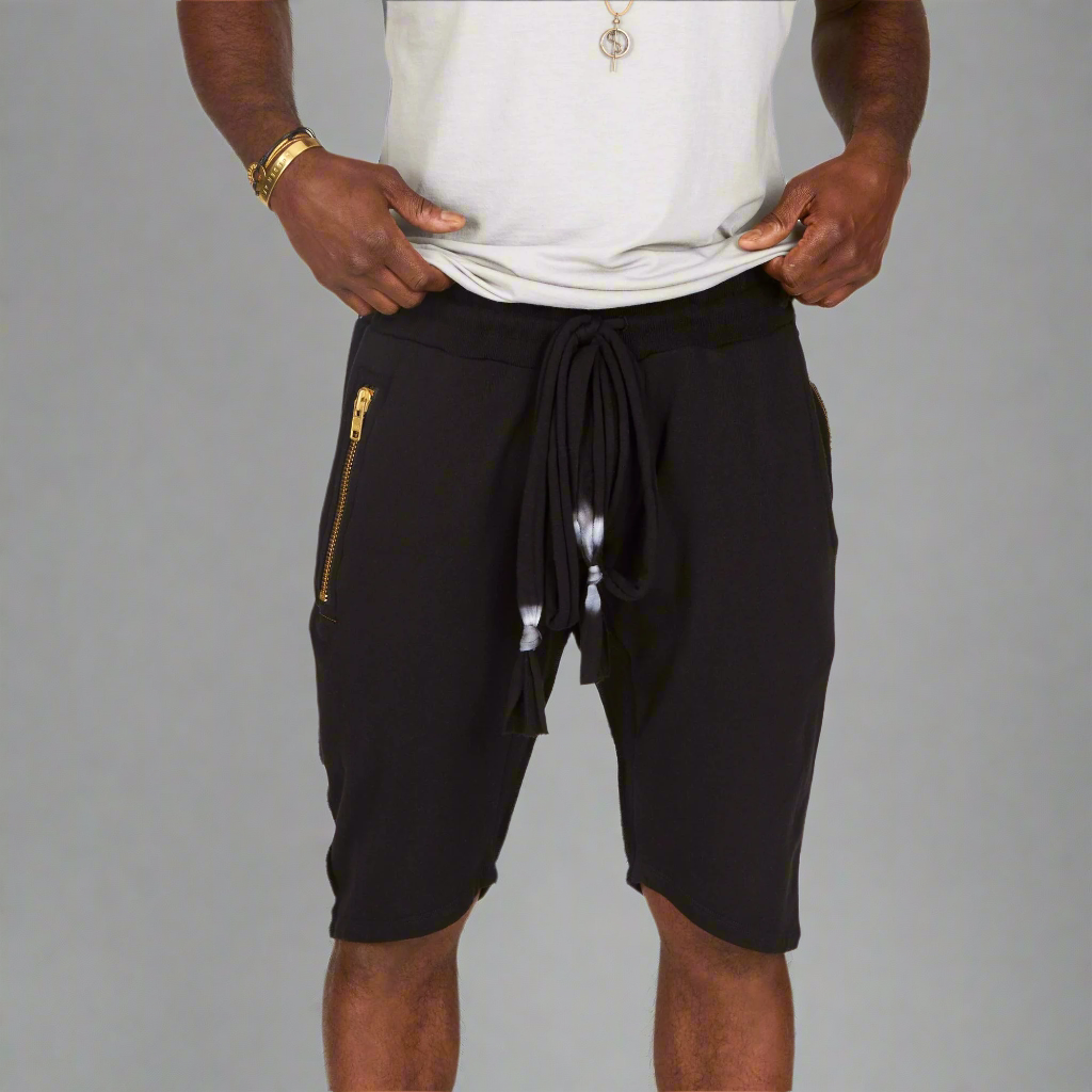 A man modeling black milanos mid shorts
