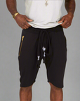 A man modeling black milanos mid shorts