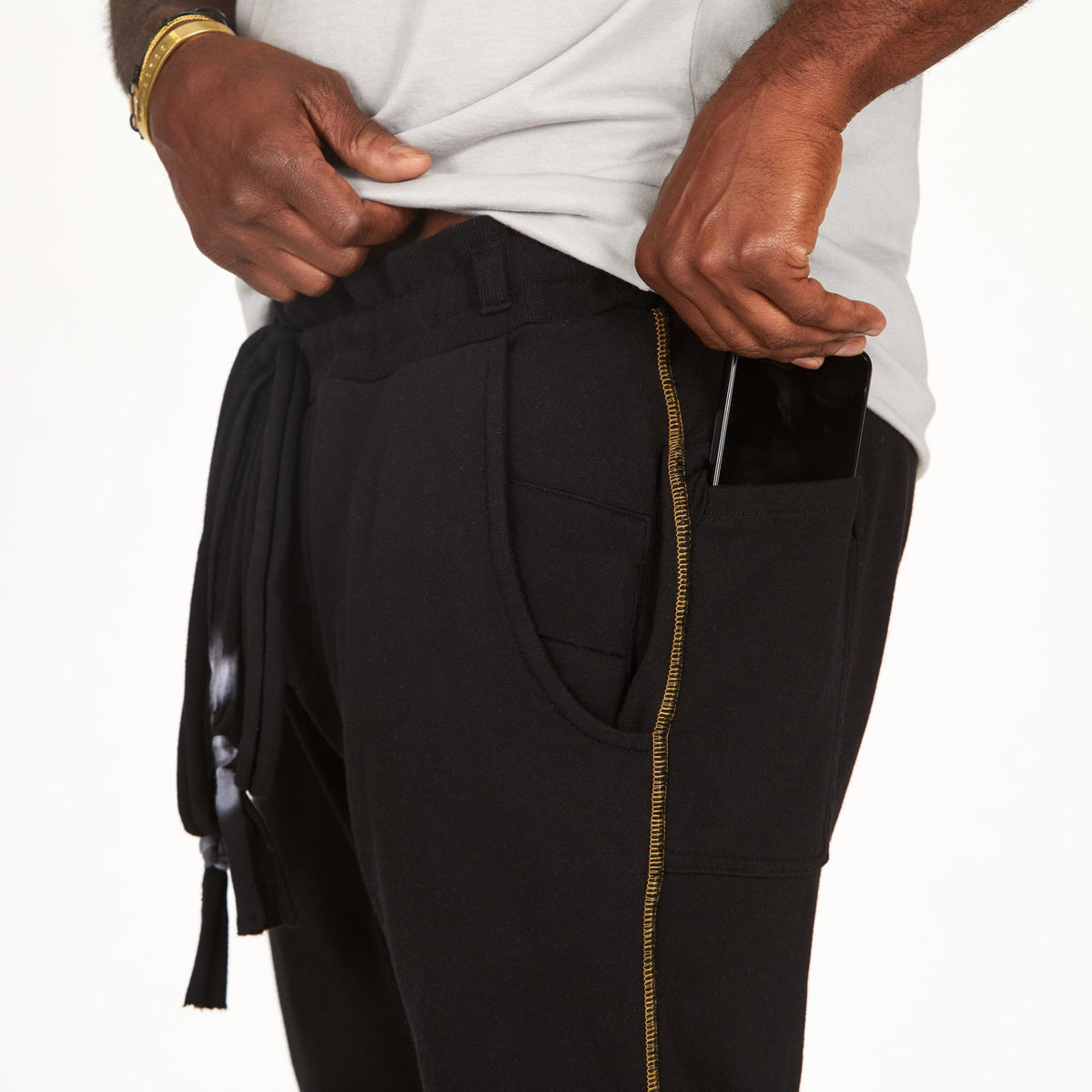 A man modeling black milanos mid shorts