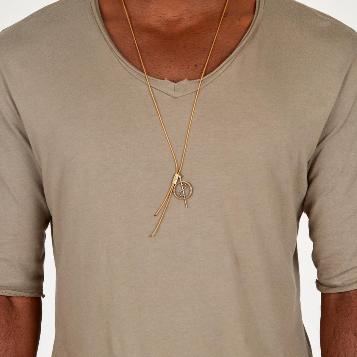 A model wearing the 108 Talisman Necklace in Antique Gold