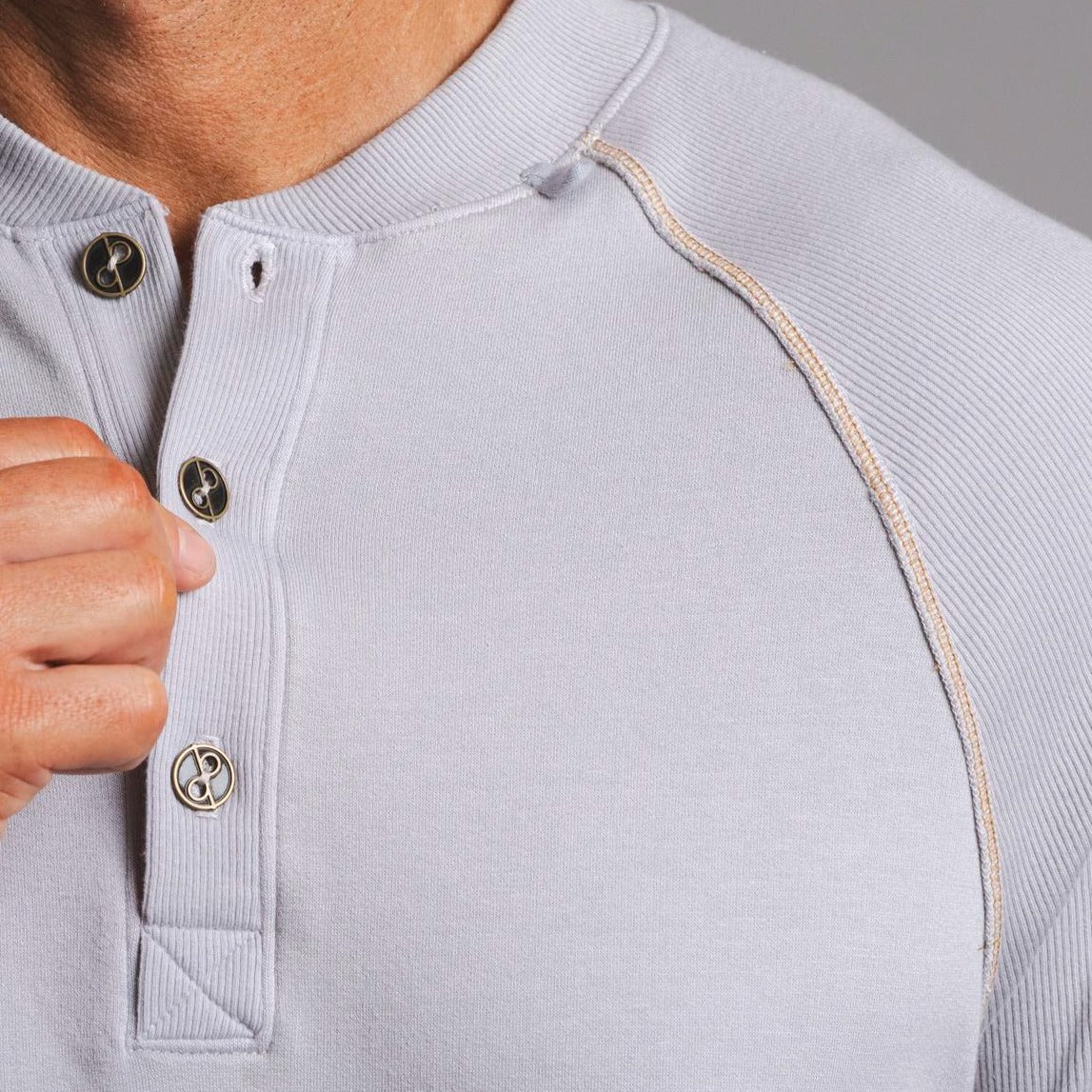Man modeling a Blue Clay colored Short Sleeve Henley shirt
