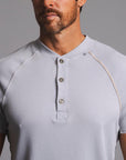 Man modeling a Blue Clay colored Short Sleeve Henley shirt