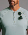 Man modeling a Agave colored Short Sleeve Henley shirt