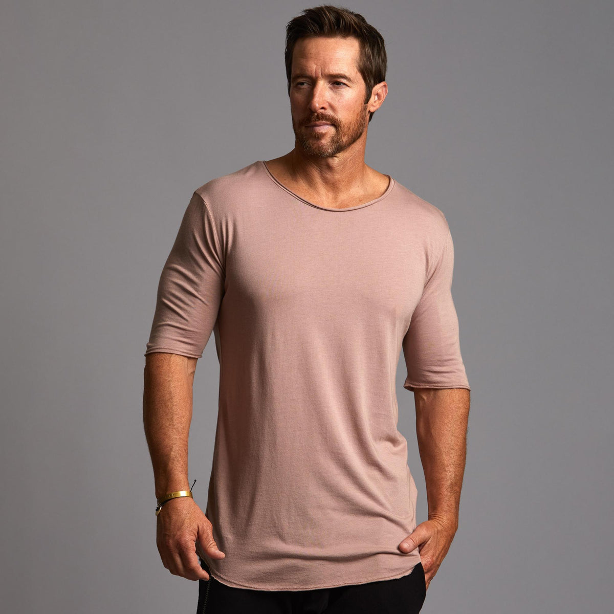Male modeling pink crew neck shirt 