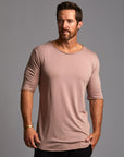 Male modeling pink crew neck shirt 
