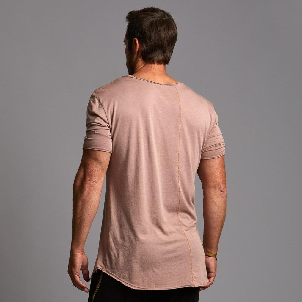 Male modeling light pink crew neck shirt