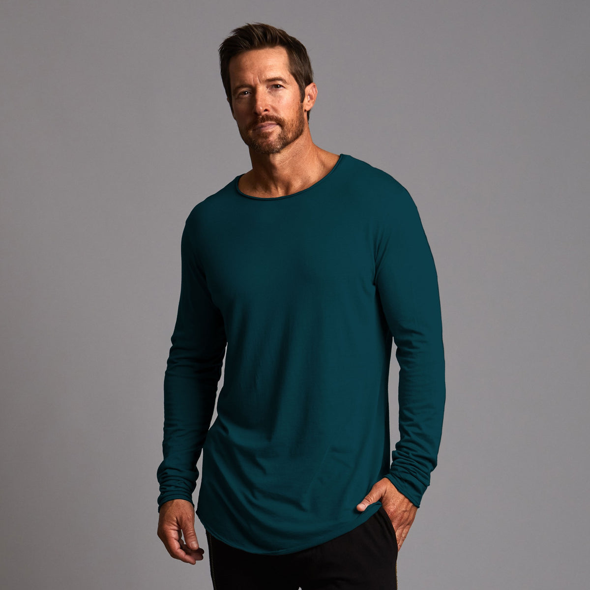 male modeling long sleeve shirt in midnight teal