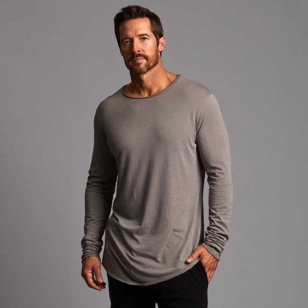 Man modeling a long sleeve crew shirt in deep clay gray