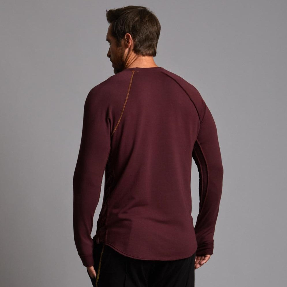 Male modeling red long sleeve raglan