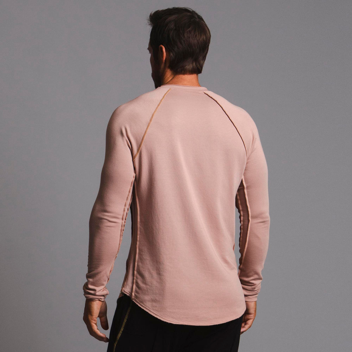Male modeling pink long sleeve raglan