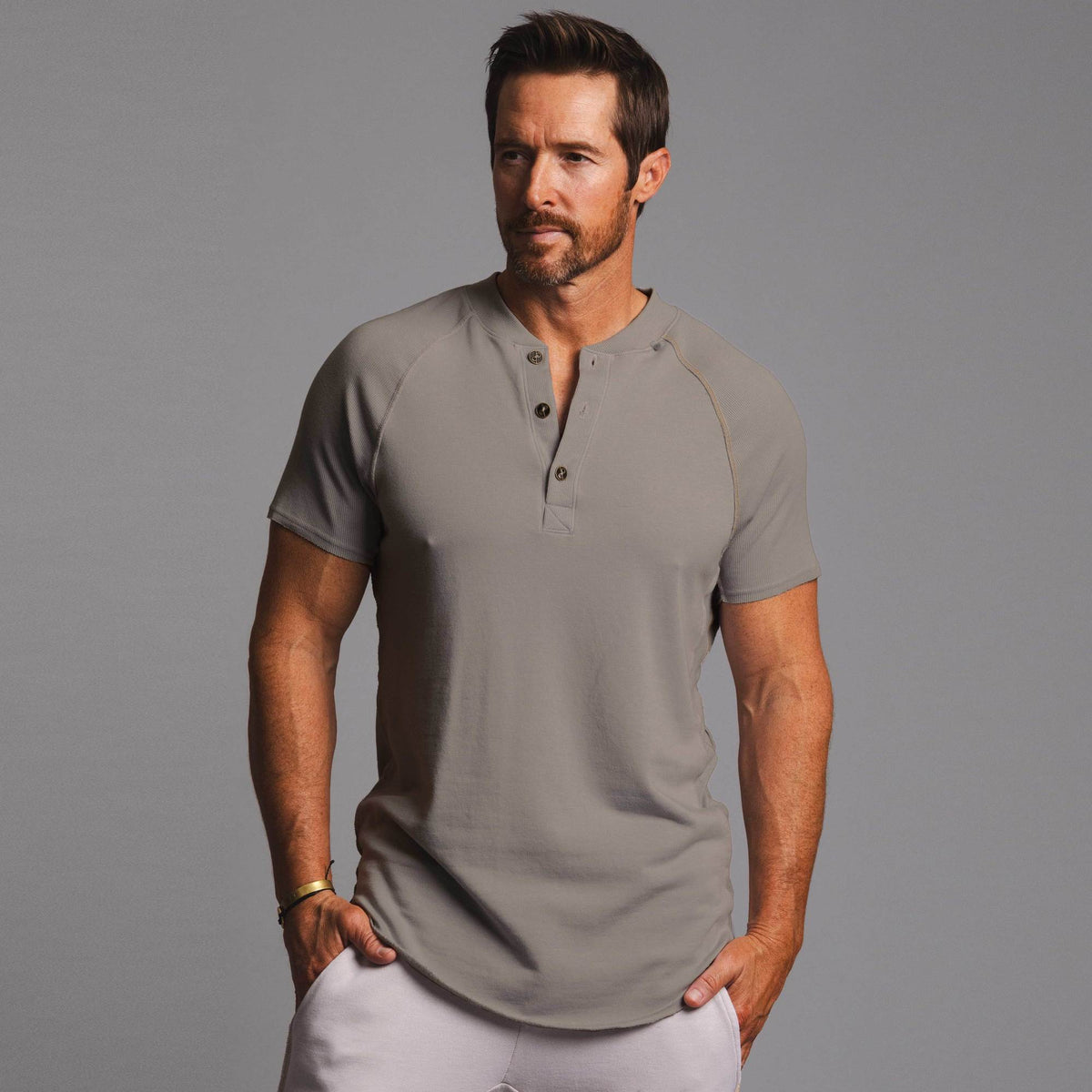 Man modeling a Deep Clay gray colored Short Sleeve Henley shirt