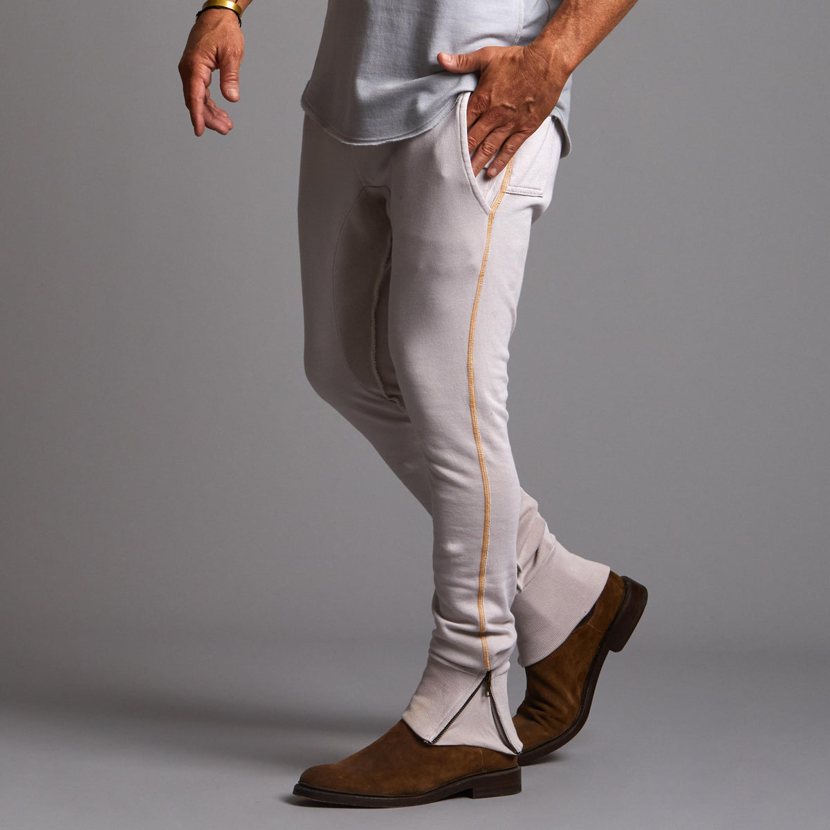 Man modeling a milano pants in white stone