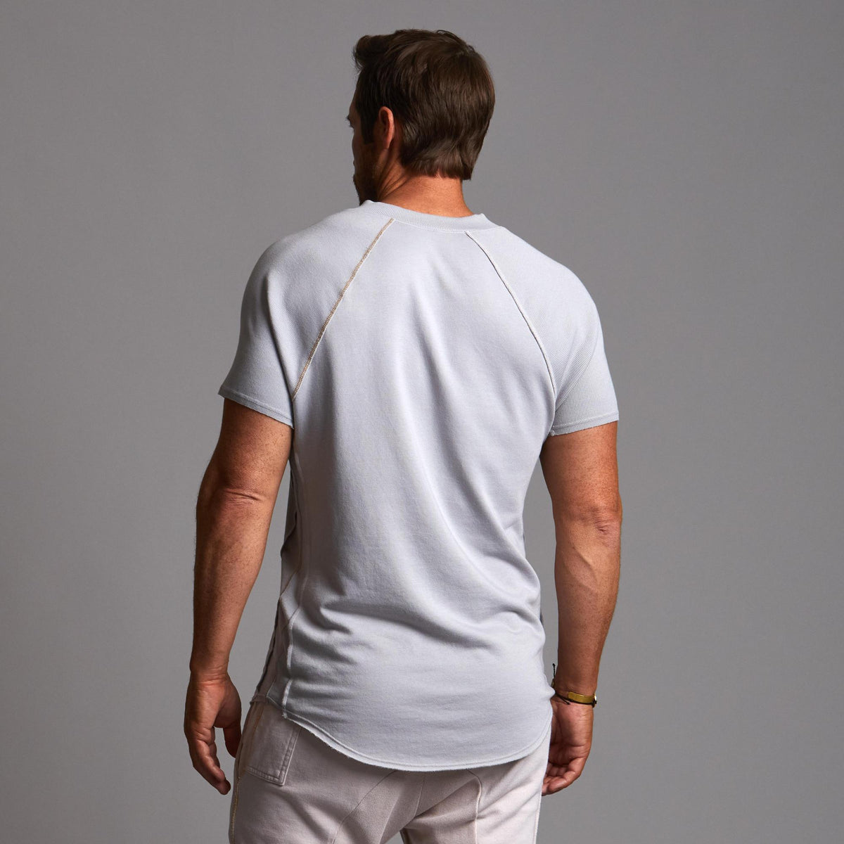 Man modeling a Blue Clay colored Short Sleeve Henley shirt