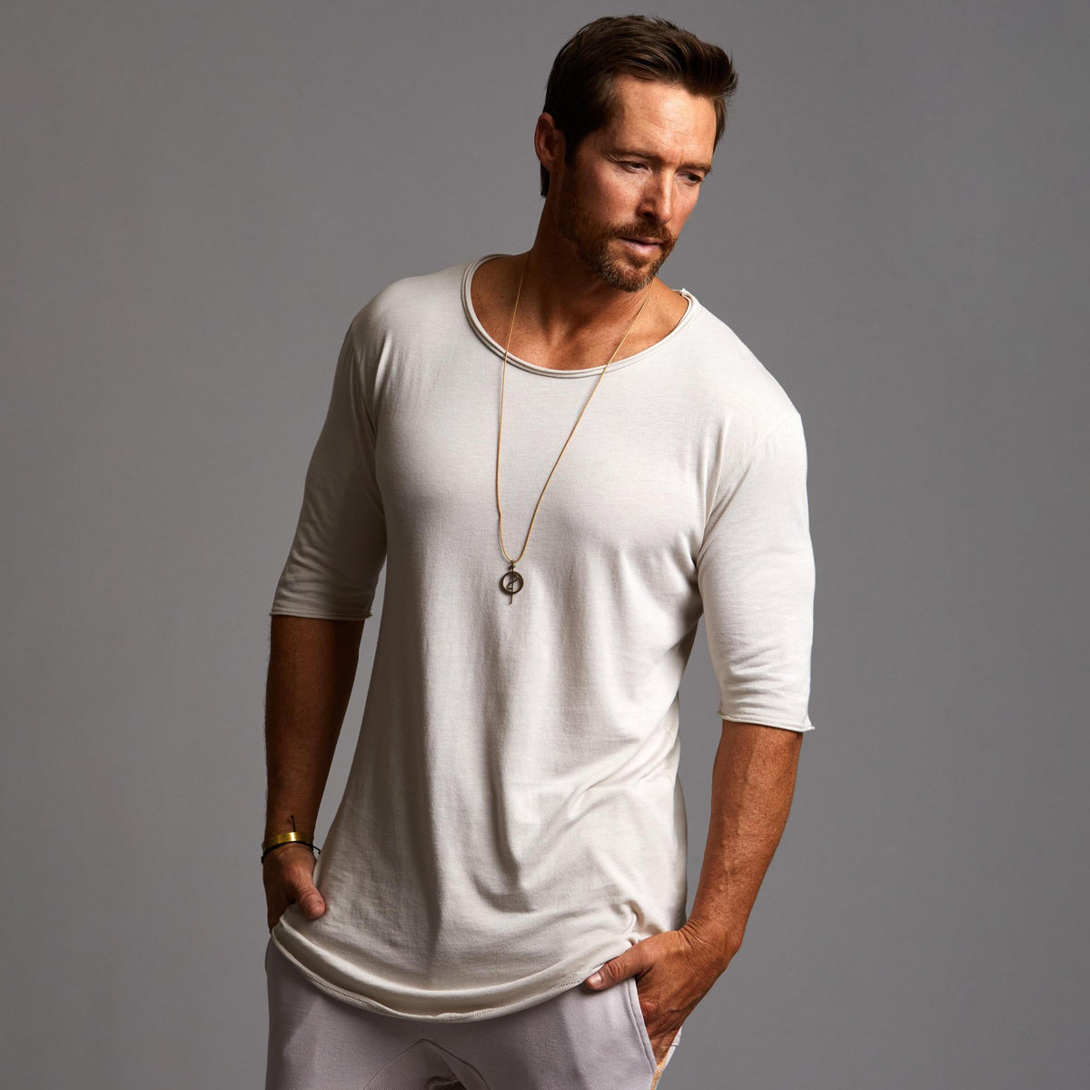 Male modeling white crew neck shirt 