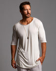 Man modeling a long sleeve shirt in white