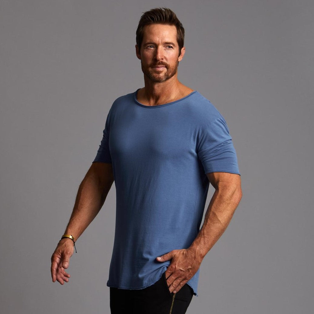 Male modeling blue crew neck shirt