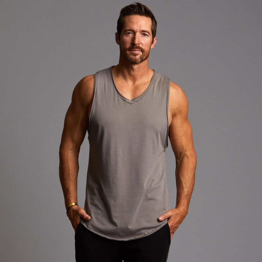 Man modeling a Clay gray tank top