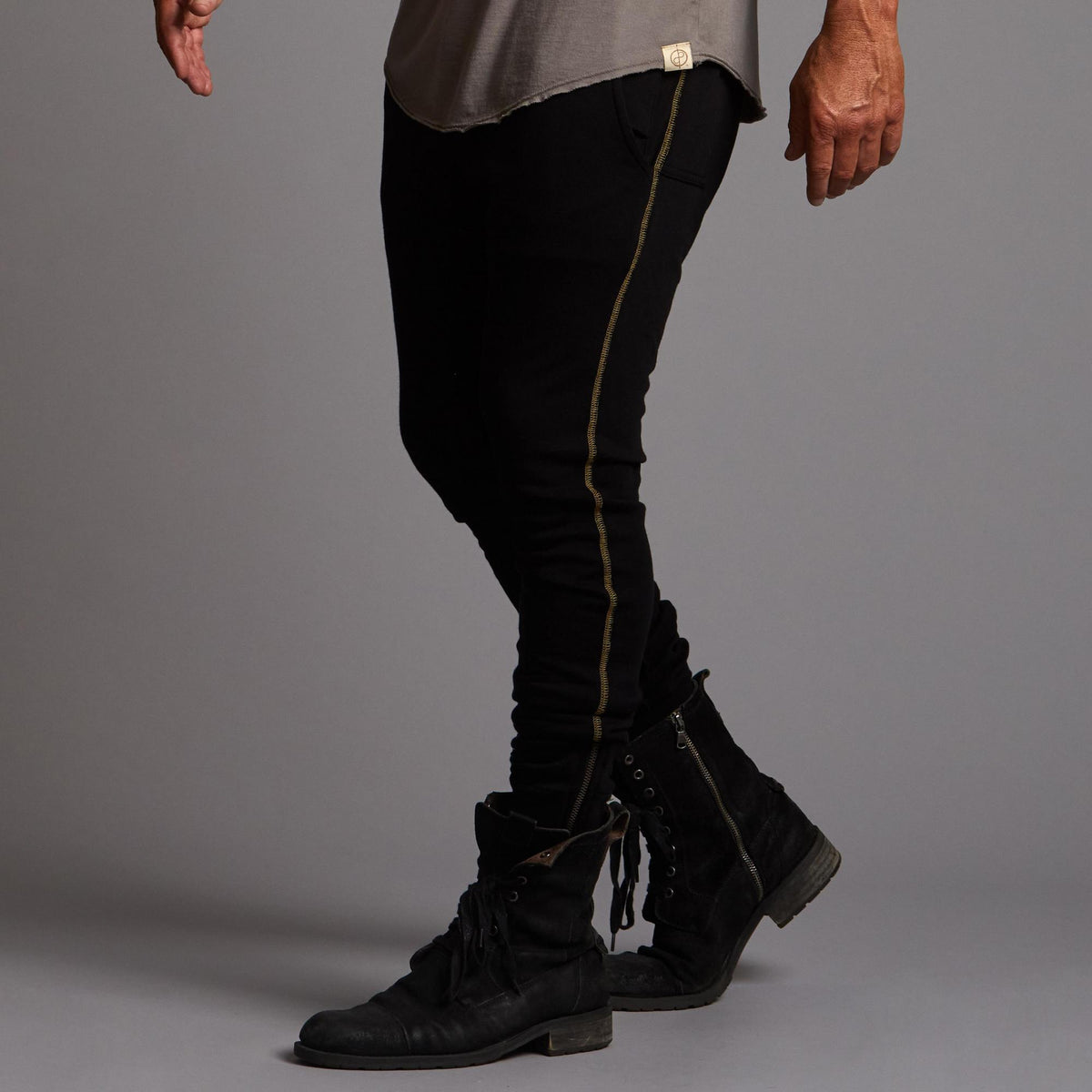 Man modeling a milano pants in black